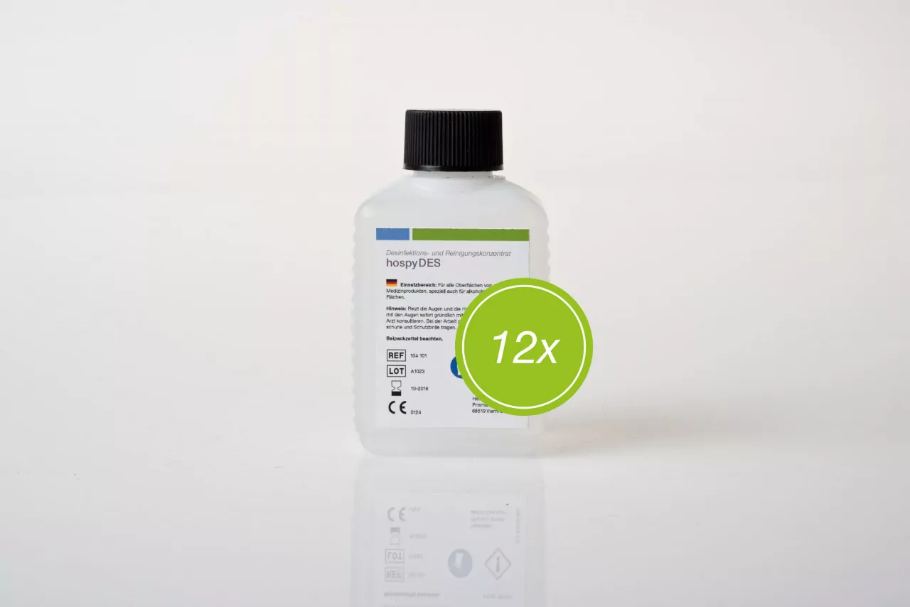 Disinfectant hospyDES bottle, standing at the front, with a green circle and the number 12x. Ideal for hygiene and cleaning in medical areas.